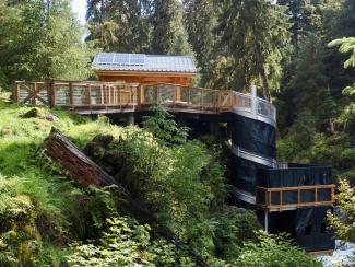 A multi-level wildlife viewing deck on a creek.