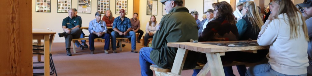 A group of people meeting in a room