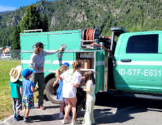 Green Truck with Children by it