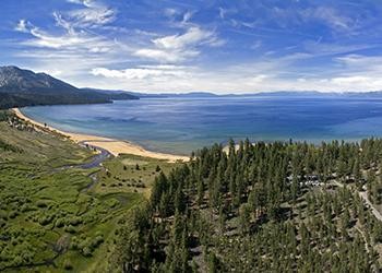 Aerial view of Lake Tahoe's south end featuring Taylor Creek, Taylor Creek Marsh and Taylor Creek Visitor Center. Photo courtesy of Drone Promotions.