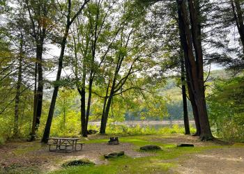 A picnic table by a lake