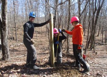 PATC volunteers install a sign