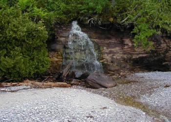 Grand Island Recreation Area - Waterfall on the beach