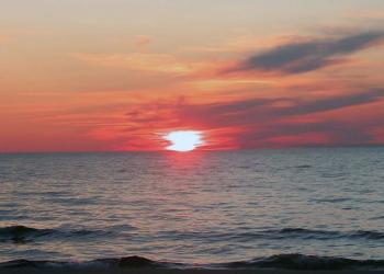 A sunset over a lake.