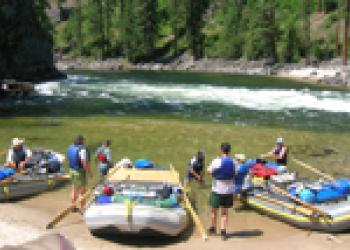 a group of rafts beside a river