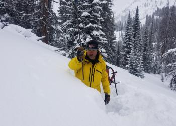 "Chris Lundy, forester, in snowpit"