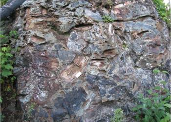 Breccia with rock hammer