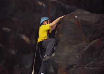 Climber on rock face