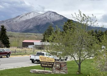 The Beartooth Ranger District sign with mountains in the background.