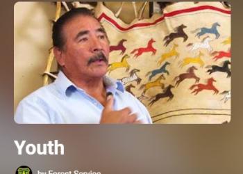 A photo of a screenshot of a youtube playlist titled "youth" with an image of a man with his hand on his chest.