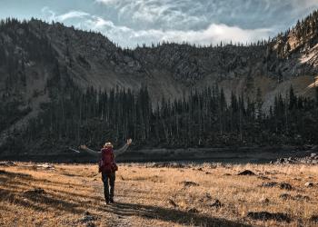 A backpacker takes in the view
