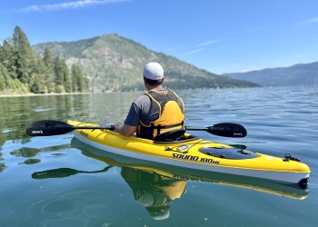 A kayaker on a large lake