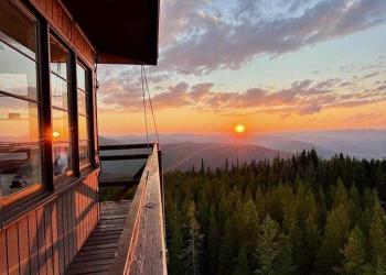 Photo lookout out of the Up Up lookout onto the sunset on the Lolo National Forest, Montana.