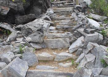 Image looking up the primitive stone stairs leading up to the Up Up lookout on the Lolo National Forest, Montana.