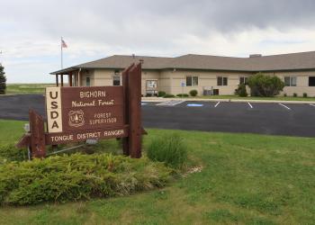Image of an office sign and building 