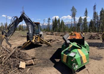 A CharBoss air curtain incinerator making biochar