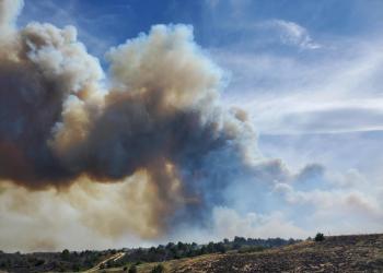 Smoke from the 201 East Fire fills the sky.