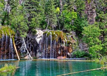 Water falls into Hanging Lake on the White River National Forest