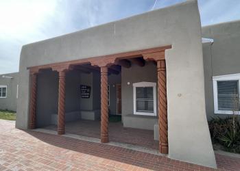Facade of an adobe building.