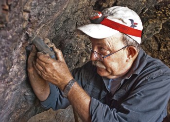 Johannes Loubser, Stratum Unlimited, using a dremel tool to restore interior of Sandia Cave 2015