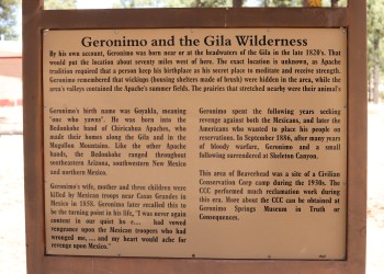 Photograph of a sign with information about the Apache Geronimo and his history on the Gila landscape