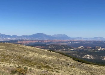 A view overlooking vistas from Capitol Reef to Navajo Mountain. Located at the Homestead Overlook