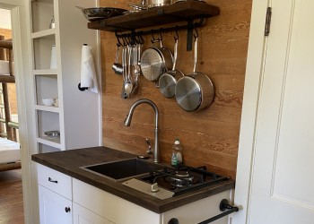 A kitchen prep area is available for guests to use. It is stocked with some pots and pans.