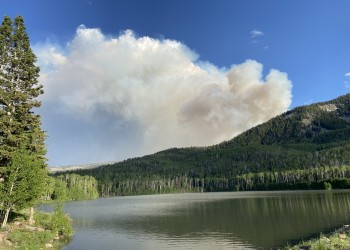 Smoke from the Little Twist fire in 2024 is shown above Middle Kents Lake on the Fishlake National Forest