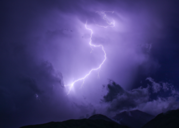 A bolt of lightning lights up the night sky
