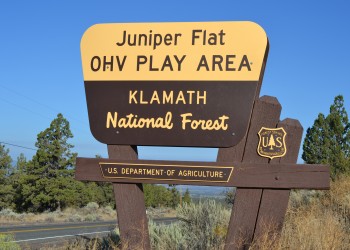 A sign that says "Juniper Flat OHV Play Area, Klamath National Forest"