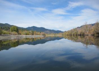 View of the sky reflected on the South Fork Trinity River. 