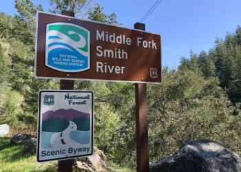 Signs for Middle Fork Smith River and National Forest Scenic Byway