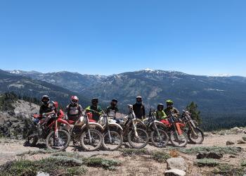 A group of people with their motorcycles.