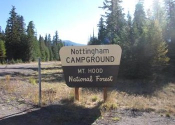A wooden sign for Nottingham Campground. 