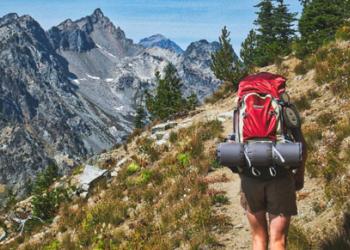 A hiker backpacks up the Entiat