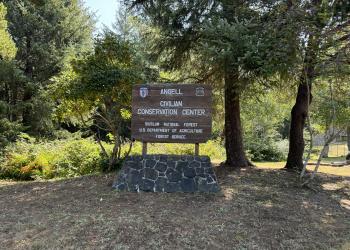 A sign that says "angell civilian conservation center"