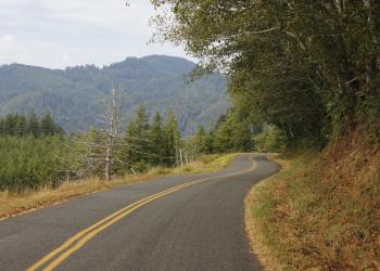 Mt hebo road with tree covered hills in the background