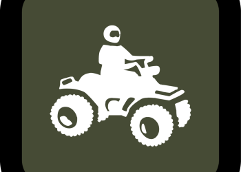 A cartoon of a person on a four wheeler.
