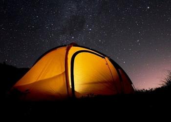 A tent under a starry sky