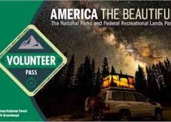 graphic of a pass and a cabin in the night