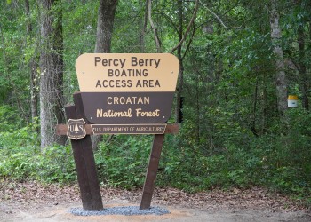Sign with woods in background