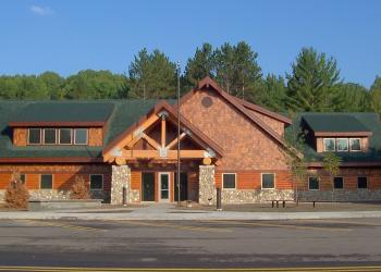 A Forest Service office with wood and rock siding. 