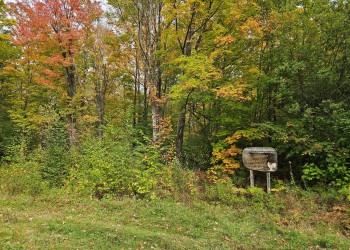 Harris Creek Hunter Walking Trail sign on the Ottawa National Forest, Bessemer Ranger District during early fall. This is the only Disabled Hunter ATV accessible Hunter Walking Trail system on the Ottawa NF. 