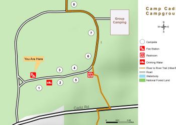 Color map showing locations of campground loop road, individual campsites, fee/information station, water spigot, vault toilet, group camping area, River to River Trail, map scale and legend.