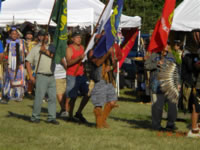 Dan Bailey carries the Forest Service flag at the Little River Band of Ottawa Indian's Pow Wow.