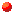 Graphic image of a small red circle.