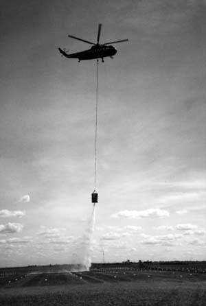 Siller Brothers S-61N helicopter dropping water using helibucket
