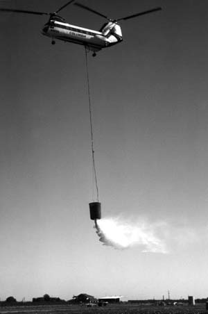 Columbia BV-107 helicopter dropping retardant using helibucket