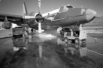 Image of a twin prop airplane undergoing a static test procedure.
