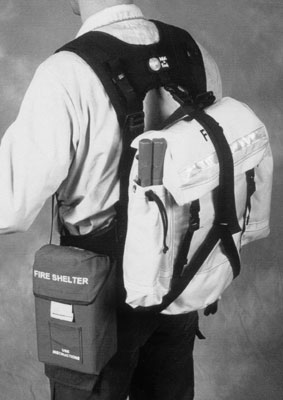 Photo of the retrofit harness with the field pack main pack and fire shelter attached.